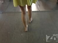 Up2912#Upskirt slim blonde in a short yellow dress. Her round ass and shaved crotch in yello