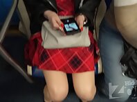 Up3001#Under the skirt of a slender brunette in a short red dress. Her round ass and shaved 