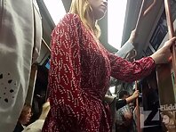 Up4281#Under the skirt of a blonde in a short red and white dress. Our cameraman managed to