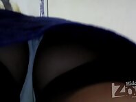 Up1995#Tanned brunette in a short blue skirt. Pretty woman standing on the steps of the legs