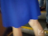 Up2664#Blonde in a short blue skirt. Pretty woman stood with her legs wide apart. Our operat