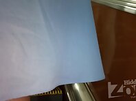 Up2902#Upskirt blonde woman in a short blue dress. The girl stood with her legs wide apart. 