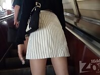 Up2961#Upskirt to slim blonde woman in short white skirt. Another good model for shooting up