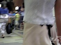 Up1852#Slender brunette in a short beige skirt. Excellent model for hot teen girls upskirt. 