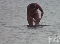 Nu1090#A beautiful young body on the background of sparkling sea